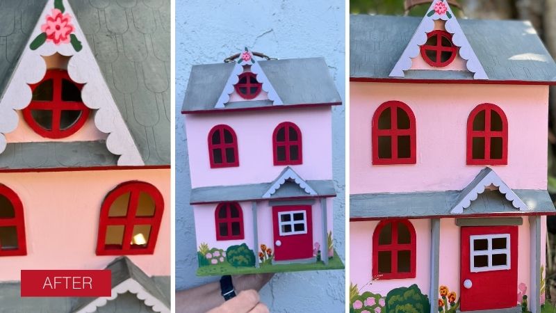 Wooden dollhouse after being painted pink and red with flowers