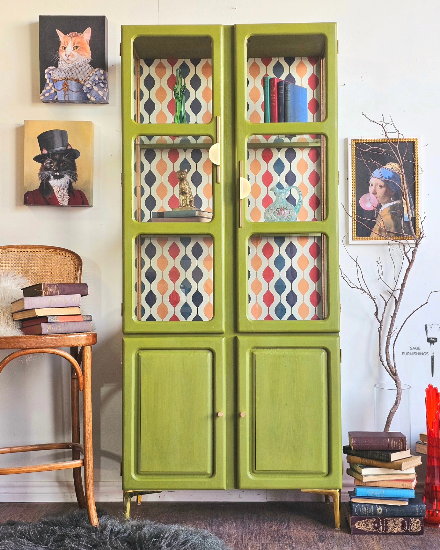 Retro green painted china cabinet with colorful 70s pattern wallpaper