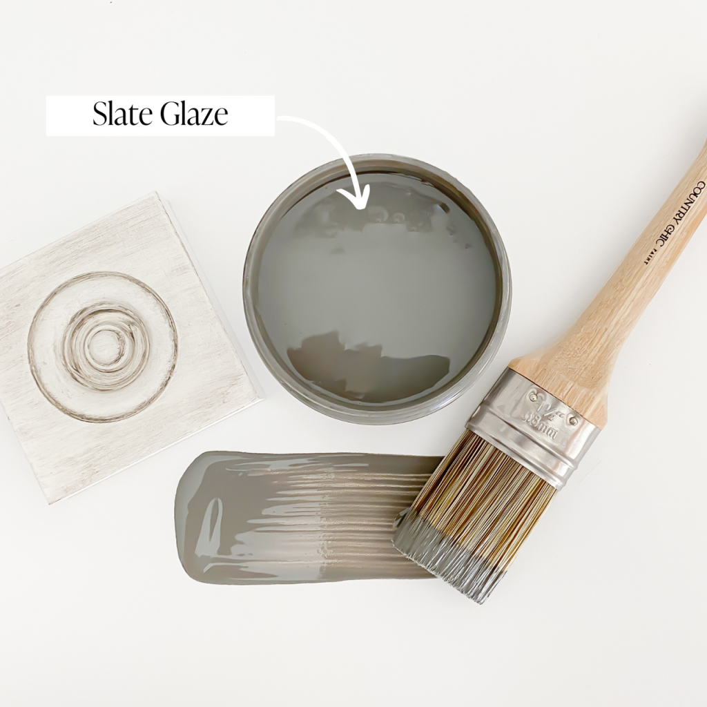 Flatlay jar of slate furniture glaze with brush stroke showing color and sample board